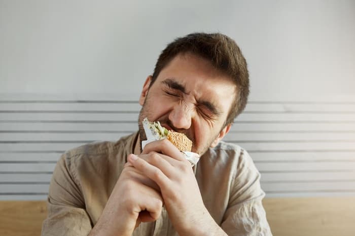 man eating food